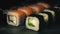 Two rows of sushi in a cloud of smoke, rolls on a slate board with chopsticks, food background, Japanese cuisine