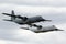 Two Royal Australian Air Force Lockheed Martin C-130J Hercules military cargo aircraft flying in formation