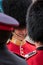 Two Royal Guard soldiers having a friendly chat during the Trooping the Colour military parade, London UK