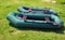 Two rubber inflatable boats on grass
