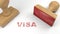 Two rubber stamps with the word visa on white immigration concept
