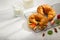 Two ruddy croissants with fresh strawberries, mint leaves, almonds and milk on a white plate. Restaurant, hotel, cafe, pastry shop