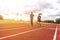 Two runners jogging on the race track, Sport and Social activity concept