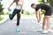 Two runners sprinting outdoors - Sportive people training in a