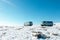 Two russian military jeeps for Lake Baikal tourism in winter parked on high view point at Olkhon cape