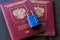 Two Russian passports locked to padlock. Symbol of anti-Russian sanctions