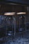 Two rustic high black stool and table