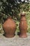 Two rusty old pots of different shapes