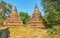 Two rusty-red stupas of Daw Gyan Pagoda, Ava