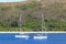 Two sailboats anchored in an island of Fiji