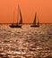Two sailboats at dusk