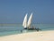 Two sailboats at  the Zanzibar beach