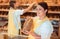 Two salesladies selling bread and other products in bakery shop