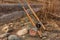 Two salmon spey fly rods resting on a log in the late afternoon sun