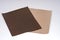 Two sandpaper sheets in bright and dark