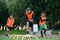 Two school boys are running ladder drills on the turf during football summer camp. Intense soccer training with coach.