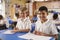 Two schoolboys in a primary school class, looking to camera