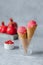 Two scoop creamy pomegranate ice cream cone. Healthy vegan desserts.