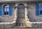 Two sculptures of lions with their paw resting on a shield guarding the home entrance in Antibes, France.