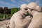 Two sculptures in Vigeland Park, Oslo, Norway. A fat man and a woman looking into each other`s eyes.