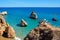 Two seagulls standing on a cliff, Praia da Rocha.