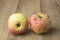 Two sear apple on wood background