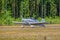 Two-seat single-engined piston-powered homebuilt airplane Vans RV-6E OH-XTH landing on Karhula aviation museum airshow. Kotka,