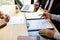 Two selection committee manager reading a resume during a job interview, Employer interviewing to ask young female job seeker for