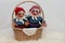 Two self made crocheted colorful gnomes with white background