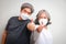 two senior asians Wearing a white hygienic mask, standing with a thumbs up.