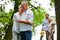 Two senior couples in garden of retirement home