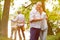 Two senior couples in garden in summer