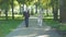 Two senior friends walking in park, both disappearing, death concept, loss