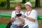 Two senior ladies reading news on tablet