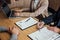 Two senior manager reading a resume during a job interview, Employer interviewing to ask young male job seeker for recruitment ta