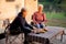 Two senior woman talking and leisure in camping, elderly doing activity recreation and leisure picnic while breakfast.