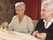 Two Senior Women Playing Dominoes