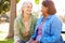 Two Senior Women Talking Outdoors Together