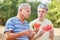 Two seniors eating watermelon