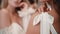 Two sensual brides wear white wedding dress closeup. Women posing for camera. Charming fashion