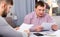 Two serious men analysing documents at table