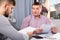 Two serious men analysing documents at table