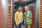 Two serious men looking at tablet in warehouse