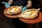 Two servings of khachapuri from tender tender dough with cheese and butter. The waiter`s hands in black gloves hold two