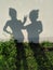 Two shadows mother and daughter outdoor wall background