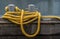 Two shipboard bitts and a yellow mooring line from close