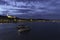 Two ships move away on the Danube as it passes through Budapest with Fishermen`s Bastion and the illuminated Buda shore, Hungary