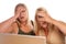 Two Shocked Women Using Laptop