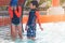 Two siblings in playing together in Water Aqua park pool