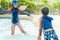 Two siblings in playing together in Water Aqua park pool